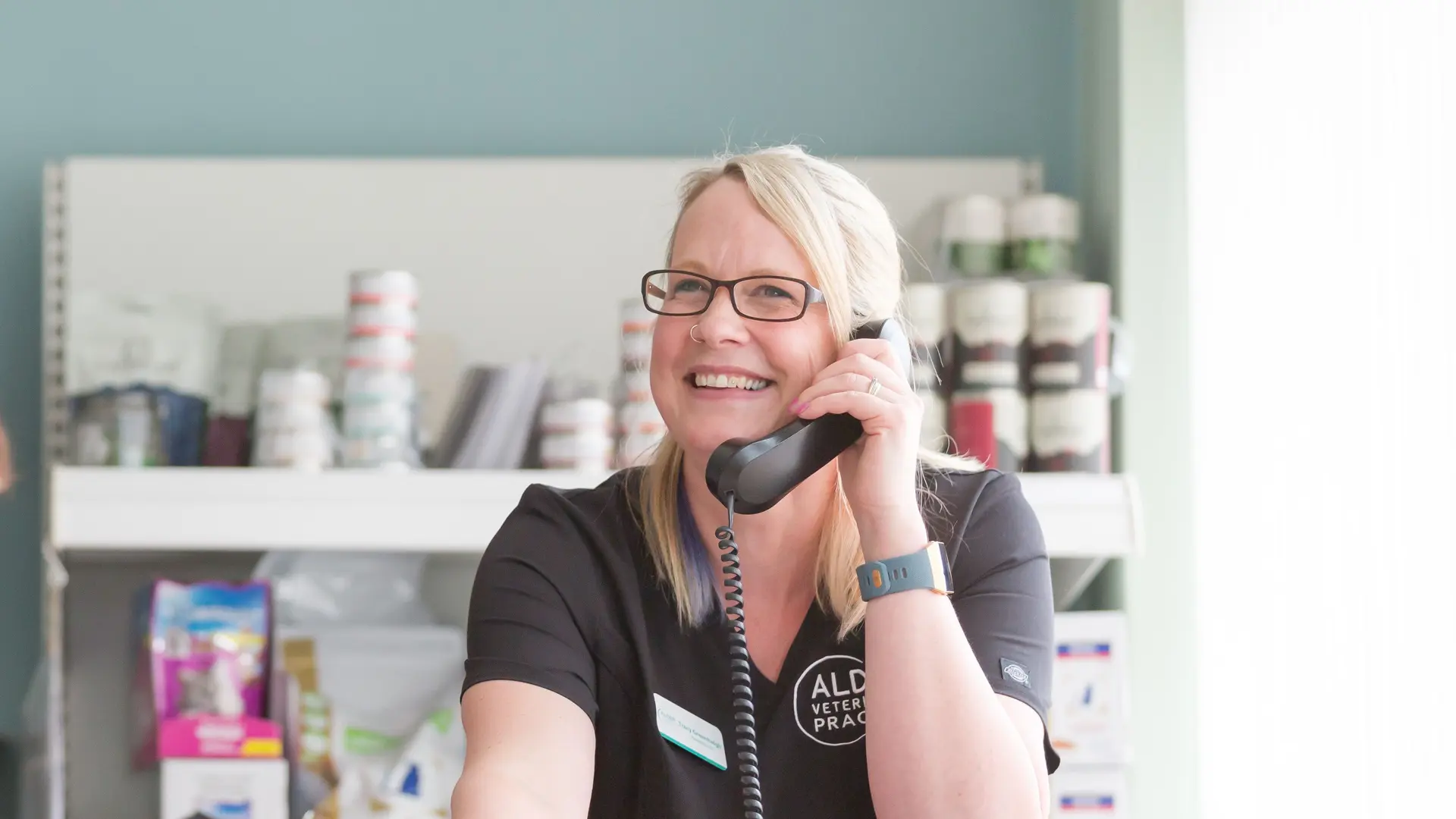 receptionist speaking on telephone