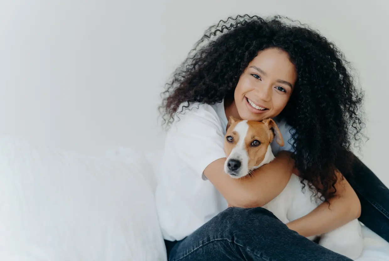 child holding a dog