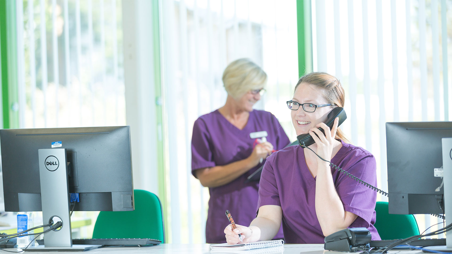 receptionist on the phone at desk