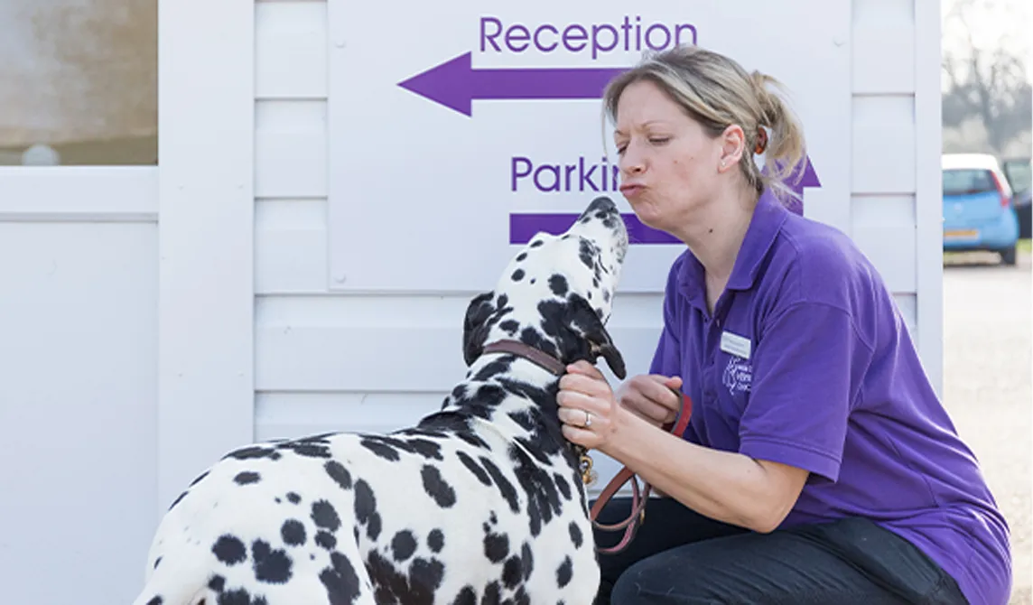 Practice manager with dalmation outside vet practice